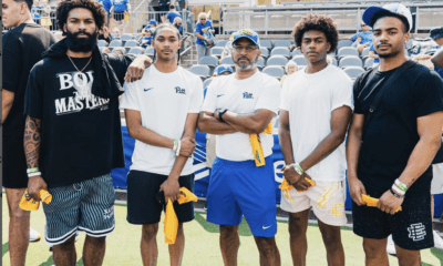 Pitt basketball guards Damian Dunn, Jaland Lowe, Brandin "Beebah" Cummings, and Ishmael Leggett pose for a photo with associate head coach Milan Brown at the Pitt Vs. Kent State football game.